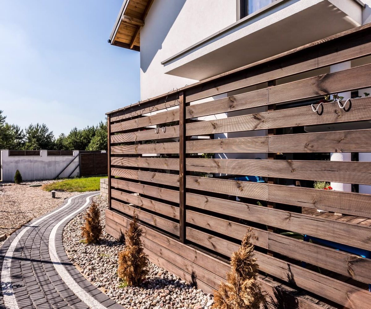 house-exterior-with-wooden-arbour-2021-08-26-15-44-09-utc (2) Garden Fencing, Durapost, Gravel Boards, Gates, Sky Fencing
